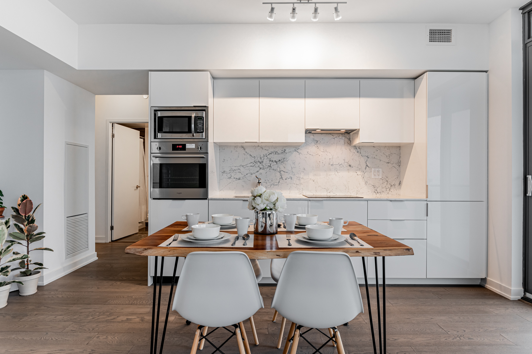 Sleek Linear kitchen and dining room table – 11 Wellesley St W Unit 5808.