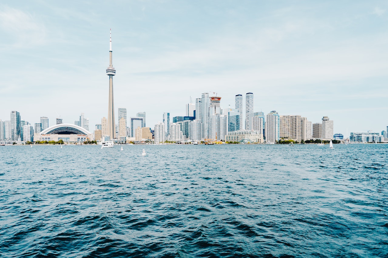Toronto skyline seen from Lake Ontario to show March 2023 housing market and spring. 