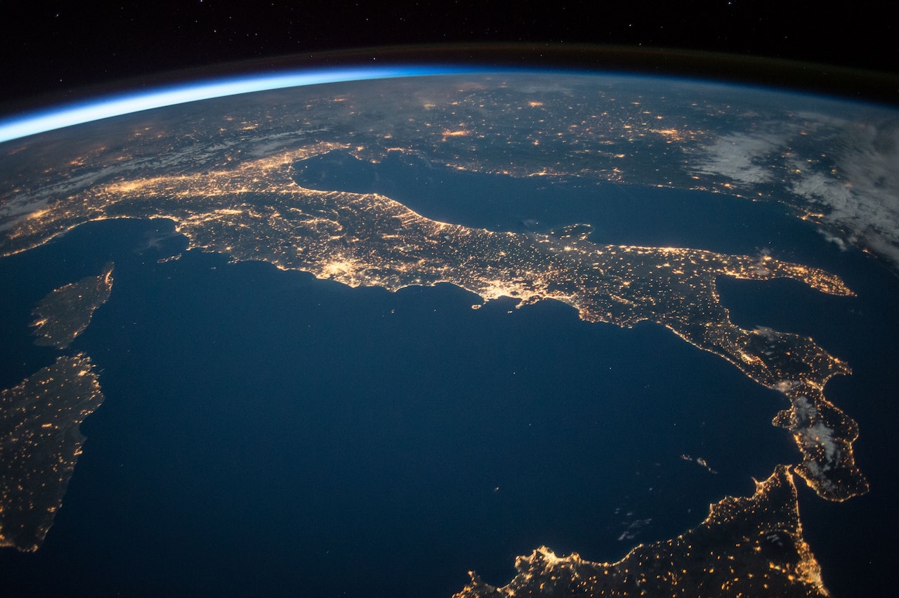 Photo of Italy from space with bright lights.