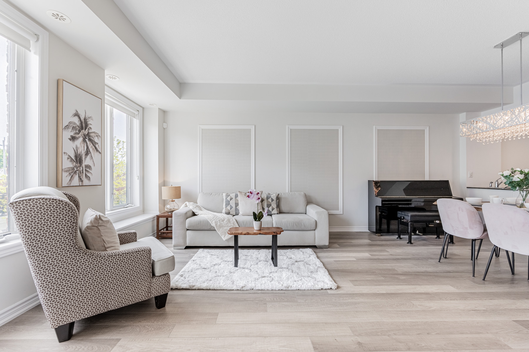 Beautiful, newly painted townhouse living room with elegant furniture and piano.