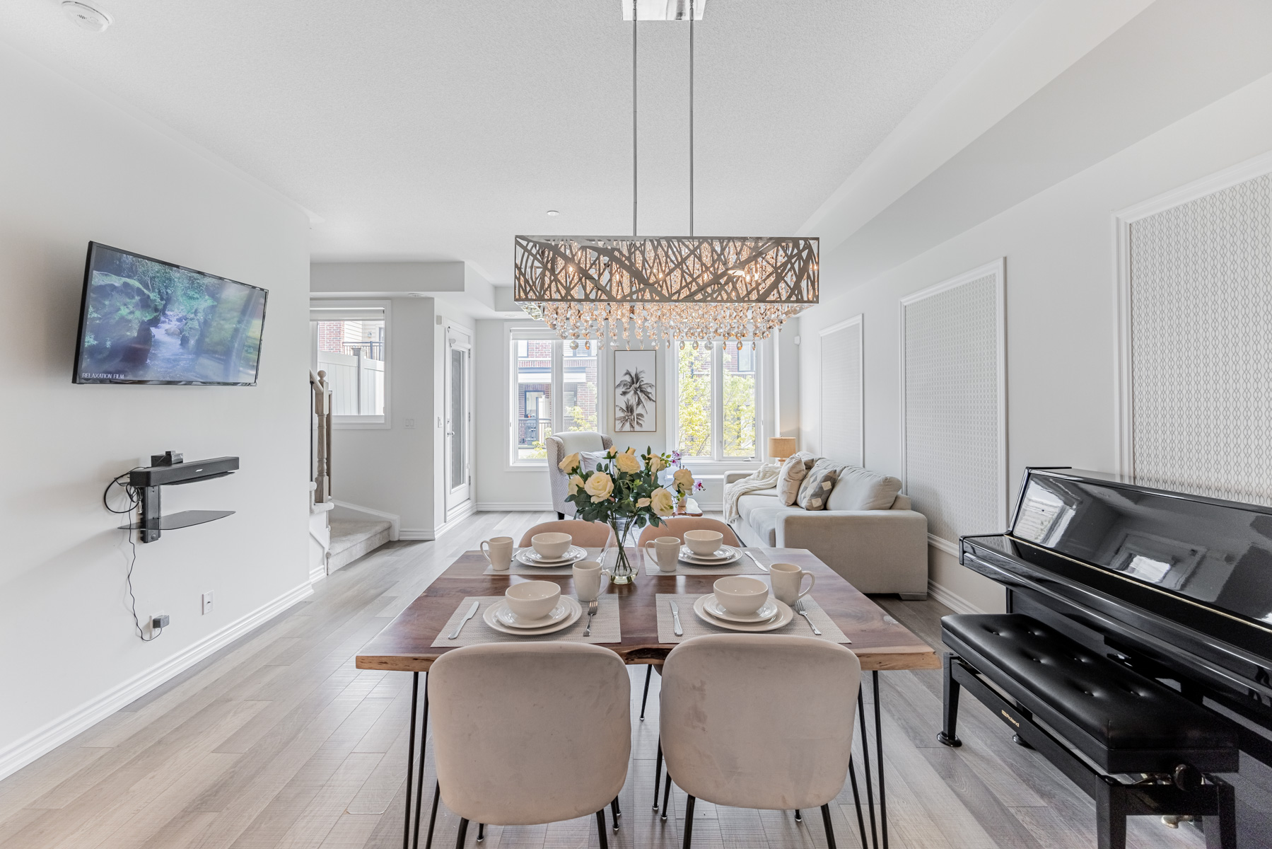 Naturally illuminated living and dining room of 20 Carnation Ave Unit 42.