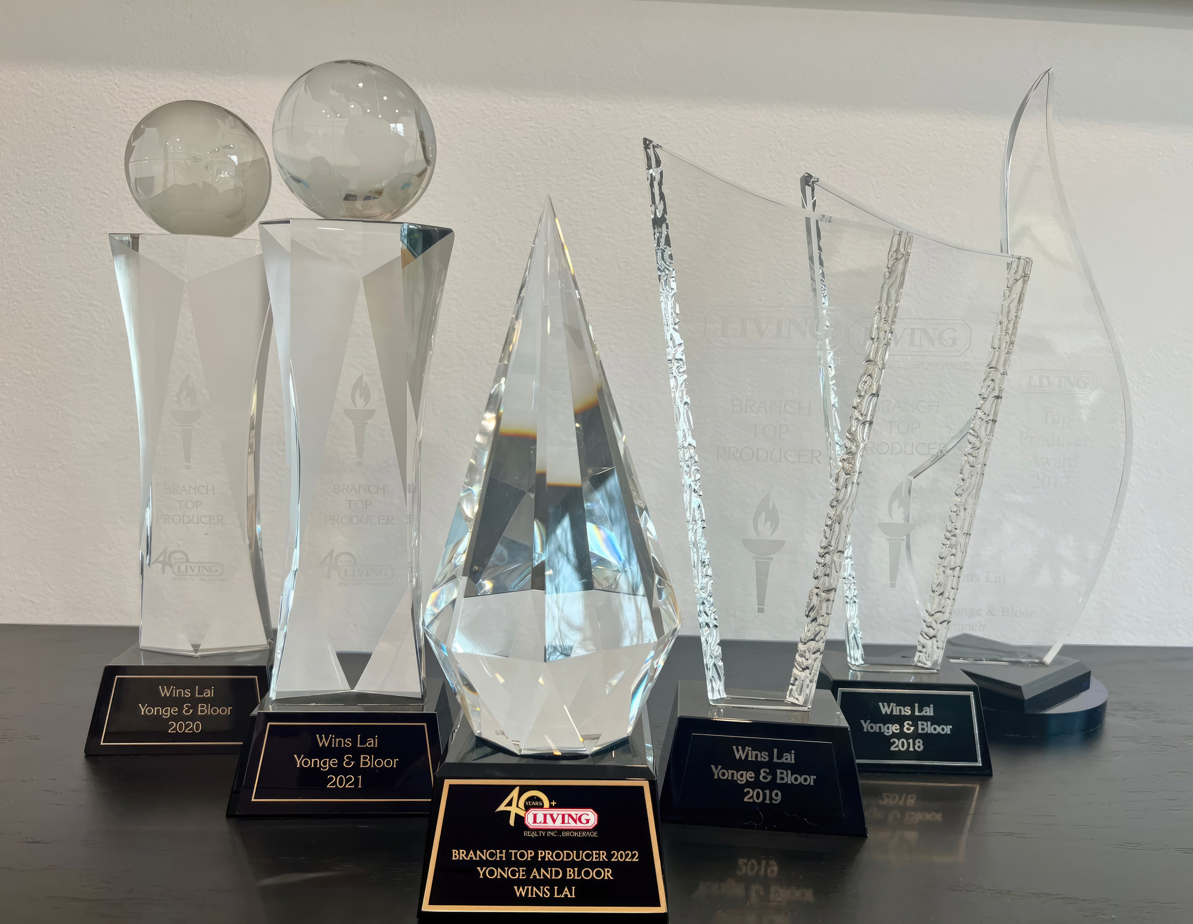Photo of 6 Top Producer real estate trophies.