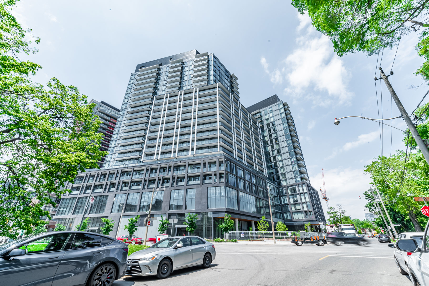 Gray concrete and glass exterior of 50 Power St condo.