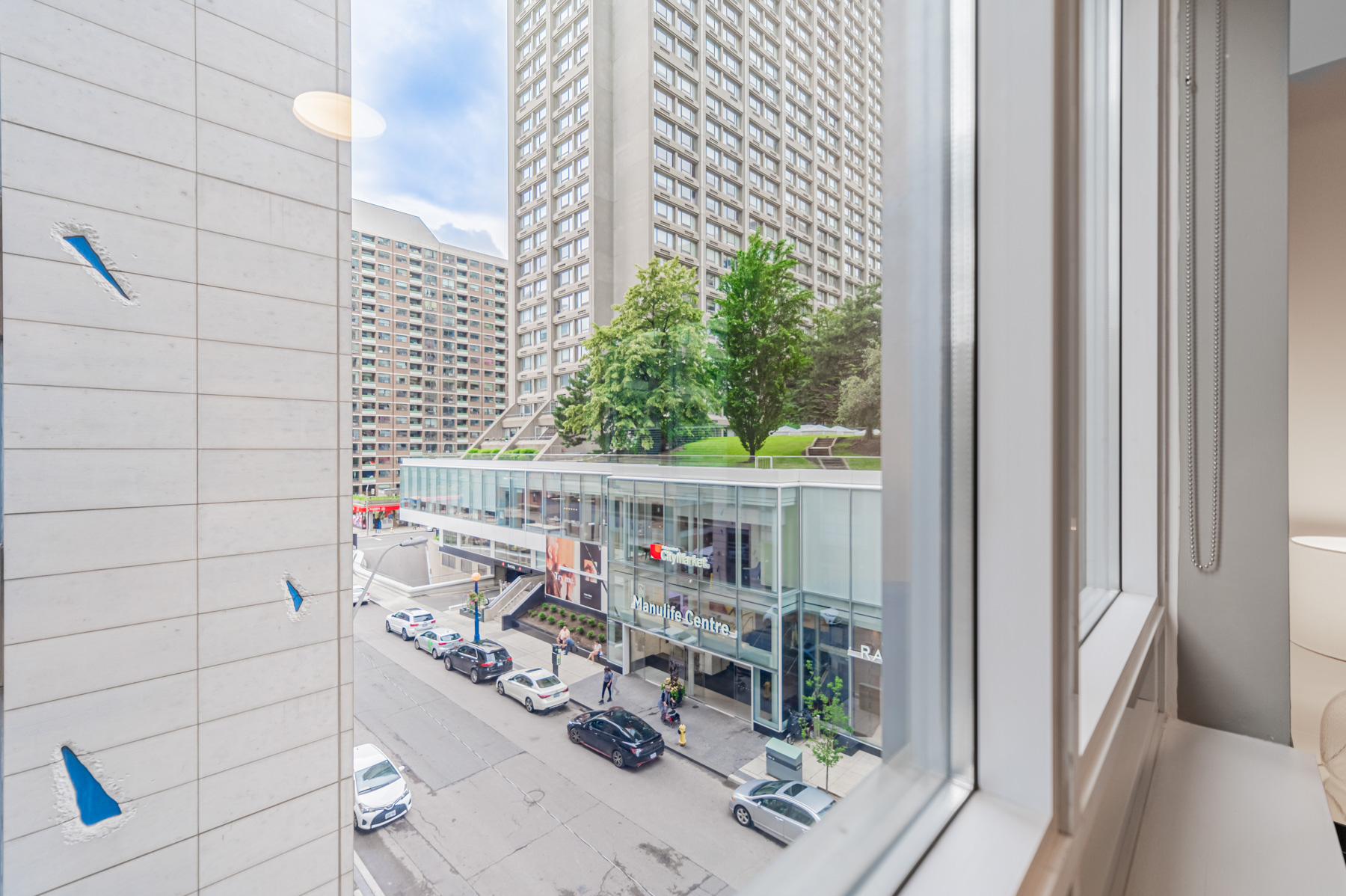 View of Manulife Centre Mall from window of 35 Balmuto St Unit 401 bedroom.