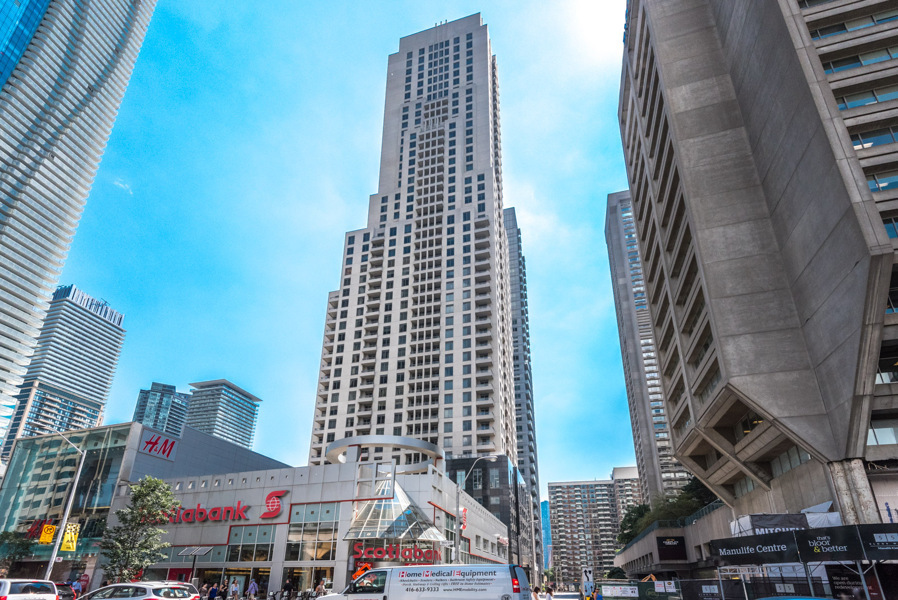 Street view of Manulife Centre mall, Scotiabank and H&M store.