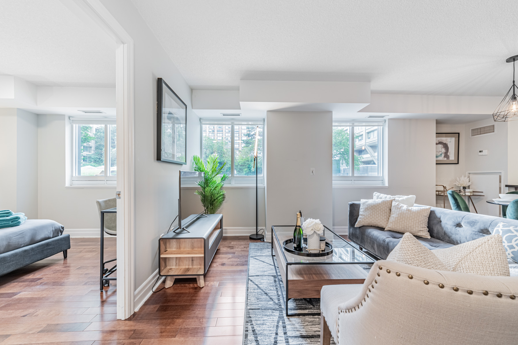 Bedroom, living room and dining room lit by windows – 35 Balmuto St Suite 401.