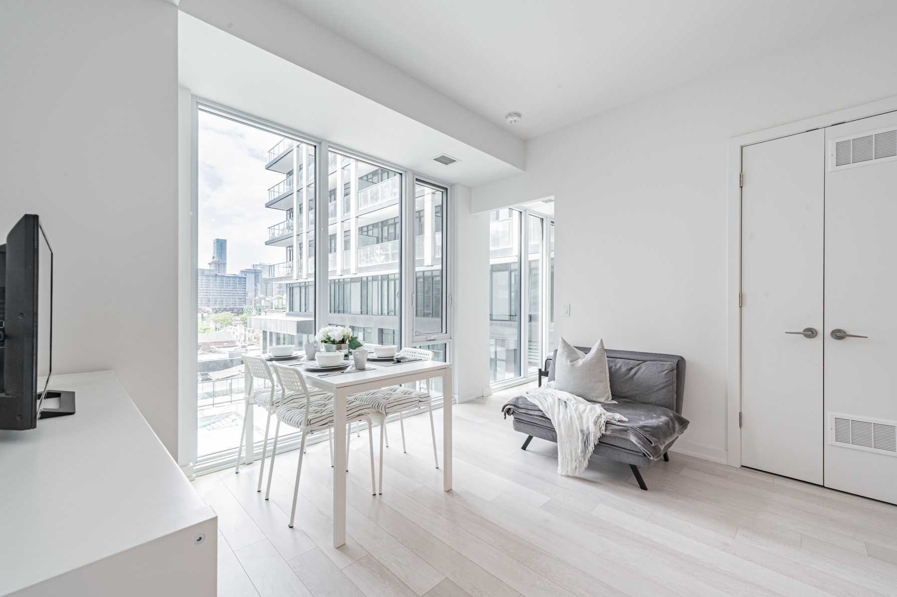 Light coloured laminate floors and gray walls of 50 Power St Unit 618.