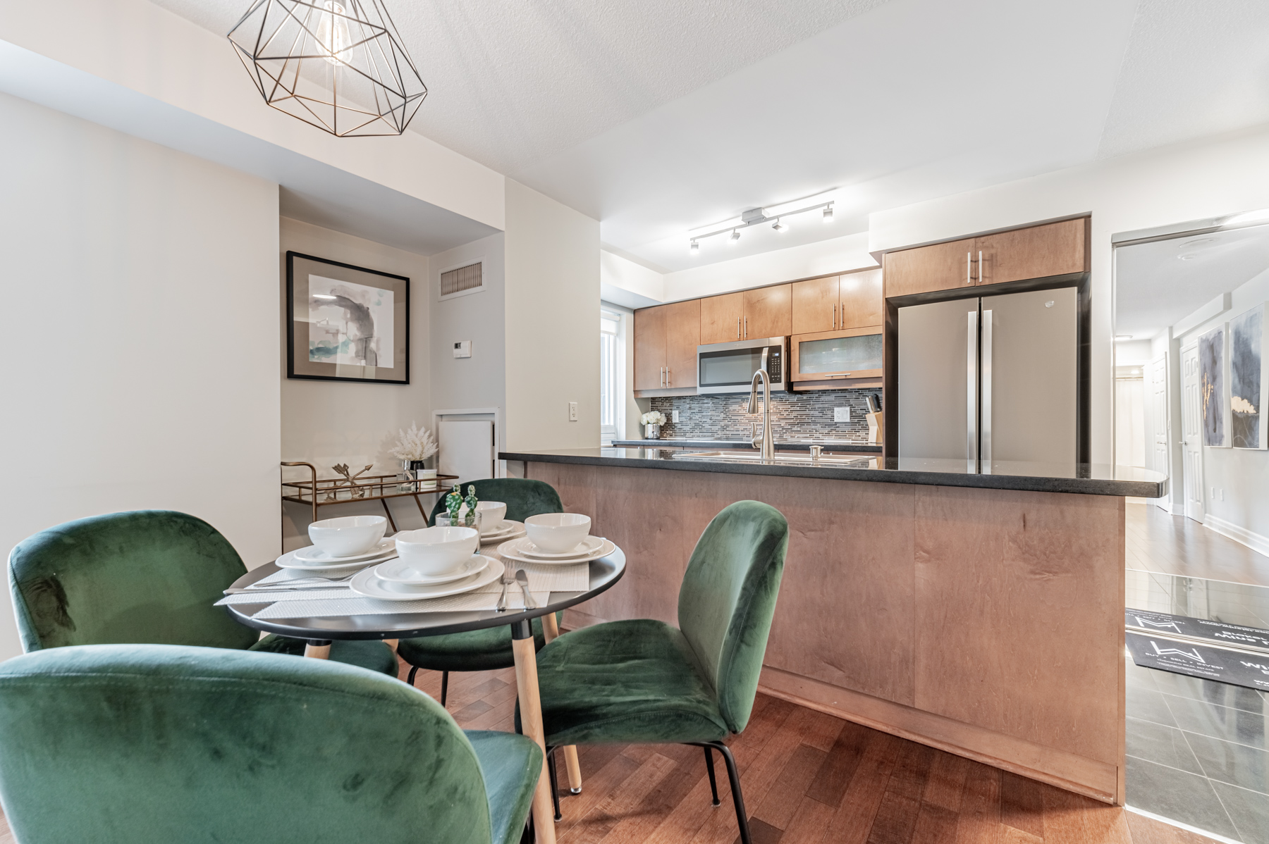 Condo kitchen with breakfast bar.