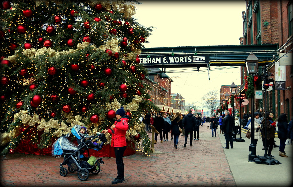 Huge Christmas tree with ornaments in Toronto Distillery District.