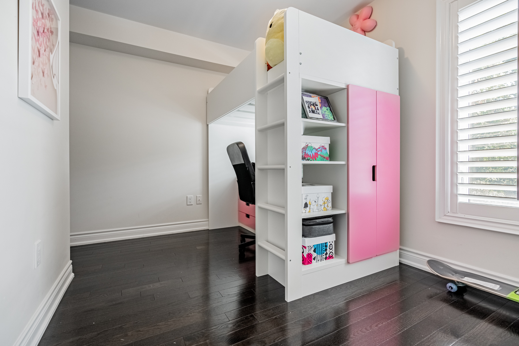 Second bedroom with dark hardwood floors and large window – 2132 Bayview Ave Unit 199.