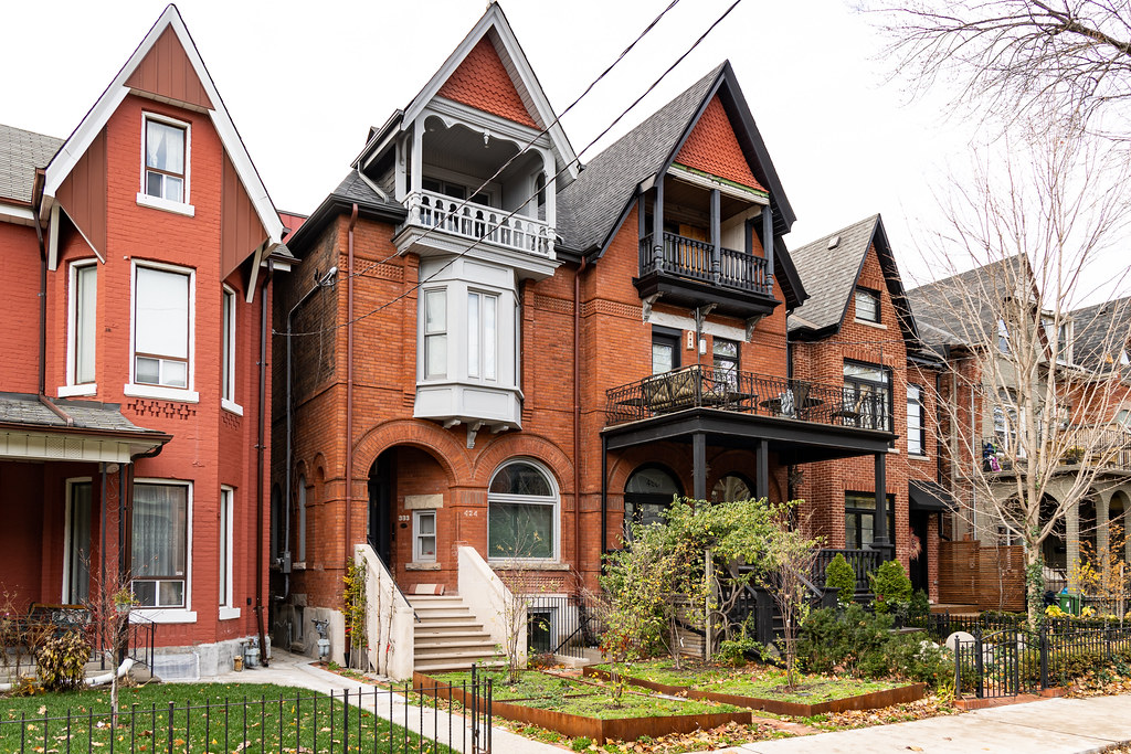 Red-brick townhouses with front yards in Palmerston-Little Italy Toronto.