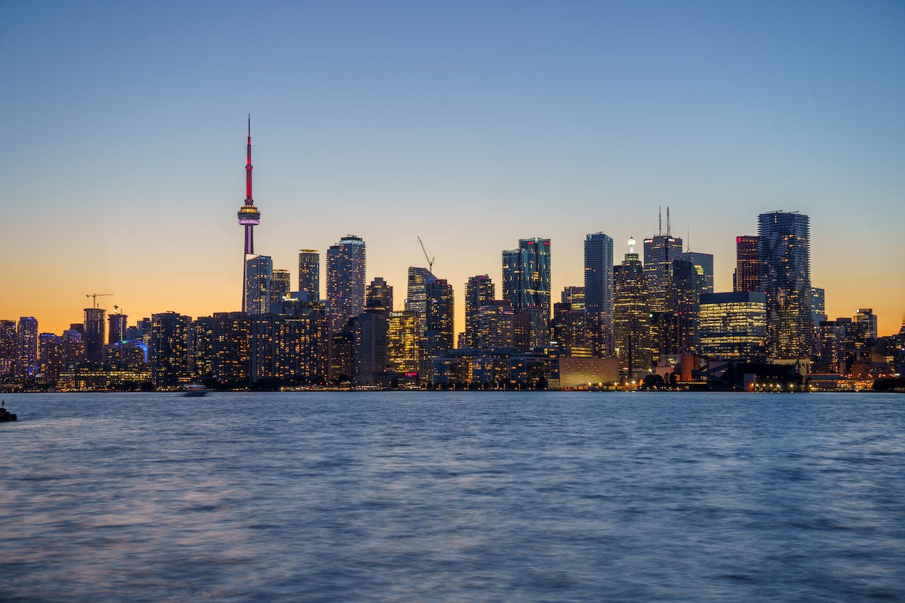 Toronto skyline at dusk seen from Lake Ontario.
