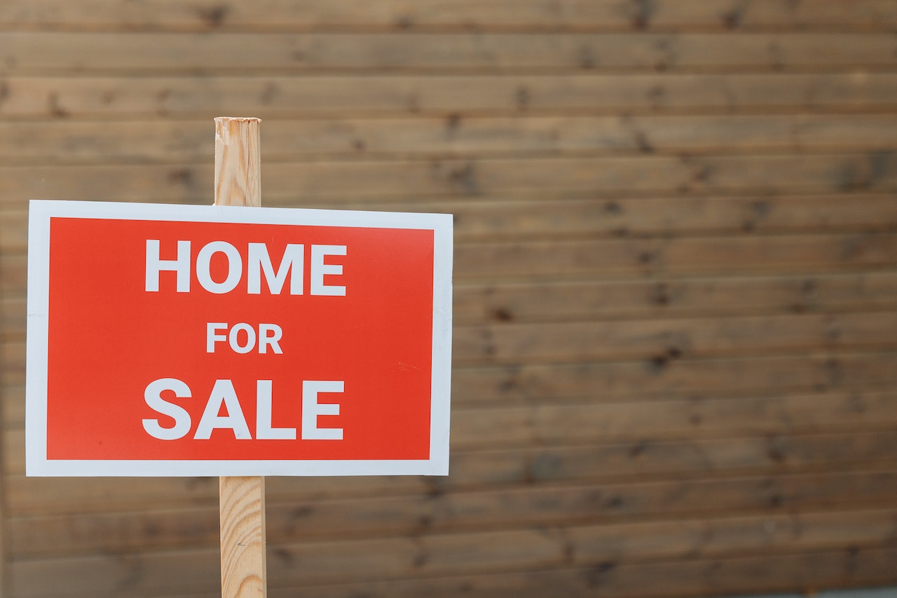 Red and white for sale sign to show increasing in listings as buyers return.