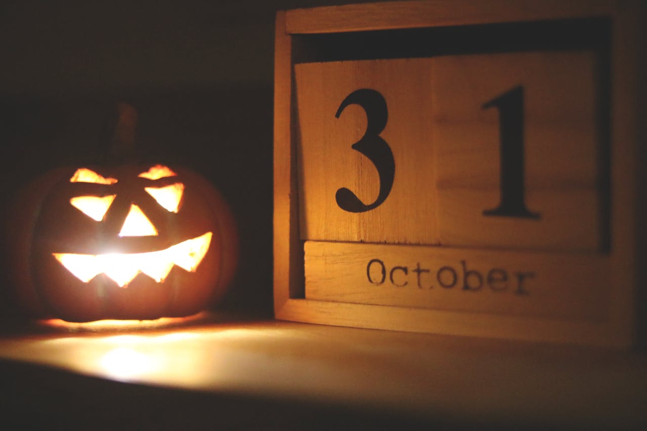 Darkly lit photo of pumpkin to show October 2023 housing market.