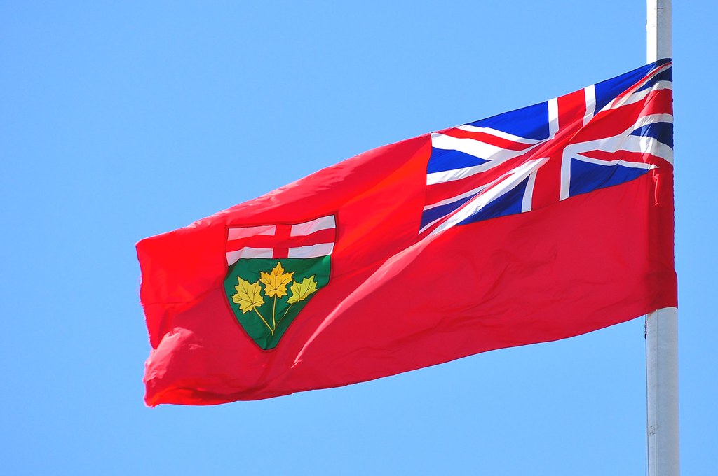 Flag of Ontario waving to show Power of Sale process in province.