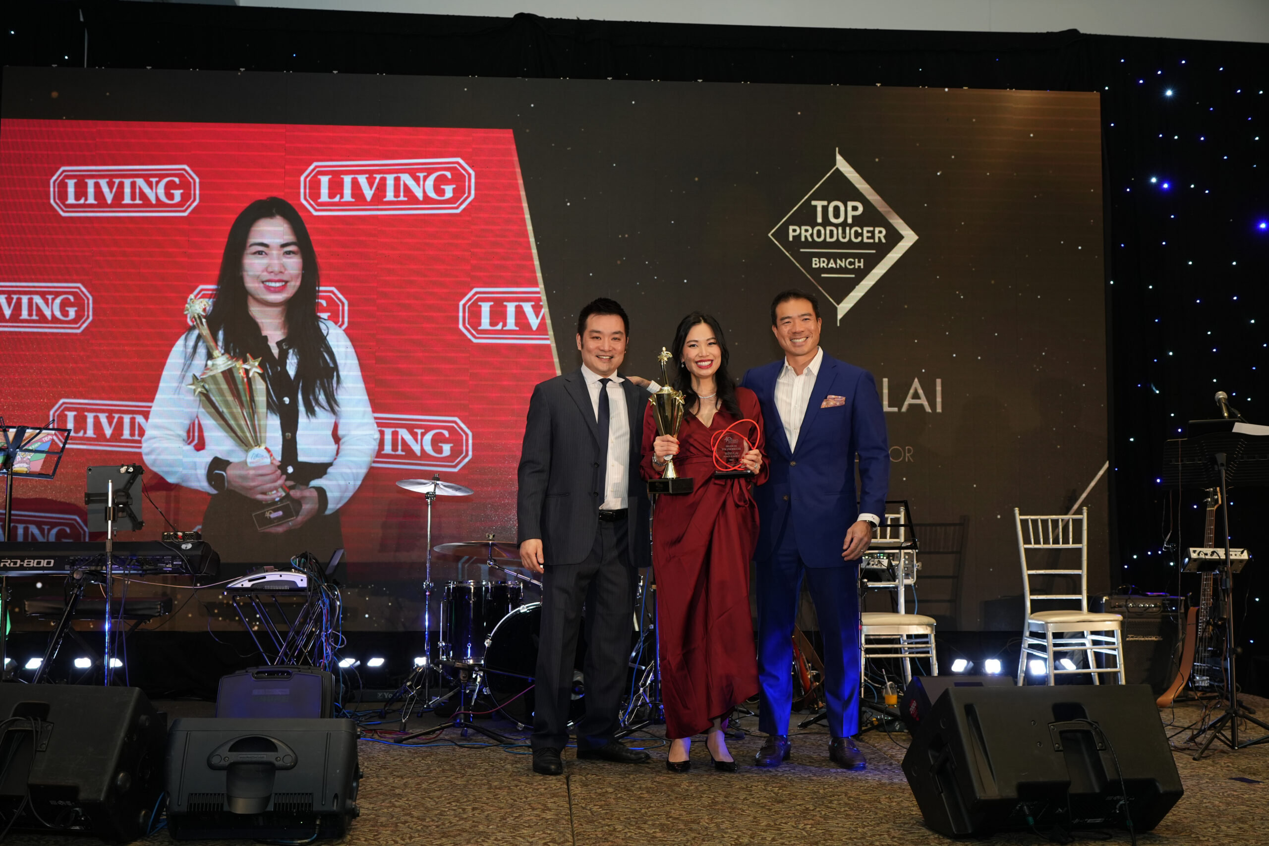 Wins Lai receiving Top Producer award from Living Realty.