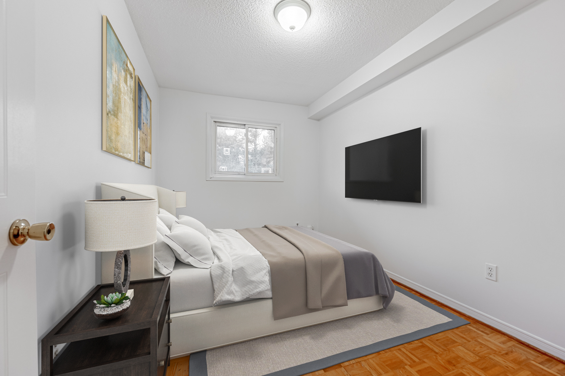 Spacious first bedroom with parquet floors – 2133 Dufferin St.