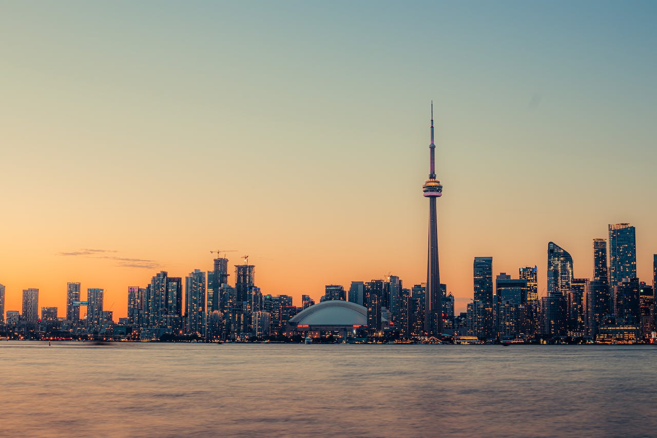 Toronto skyline at dusk from Lake Ontario to conclude November 2023 market report.