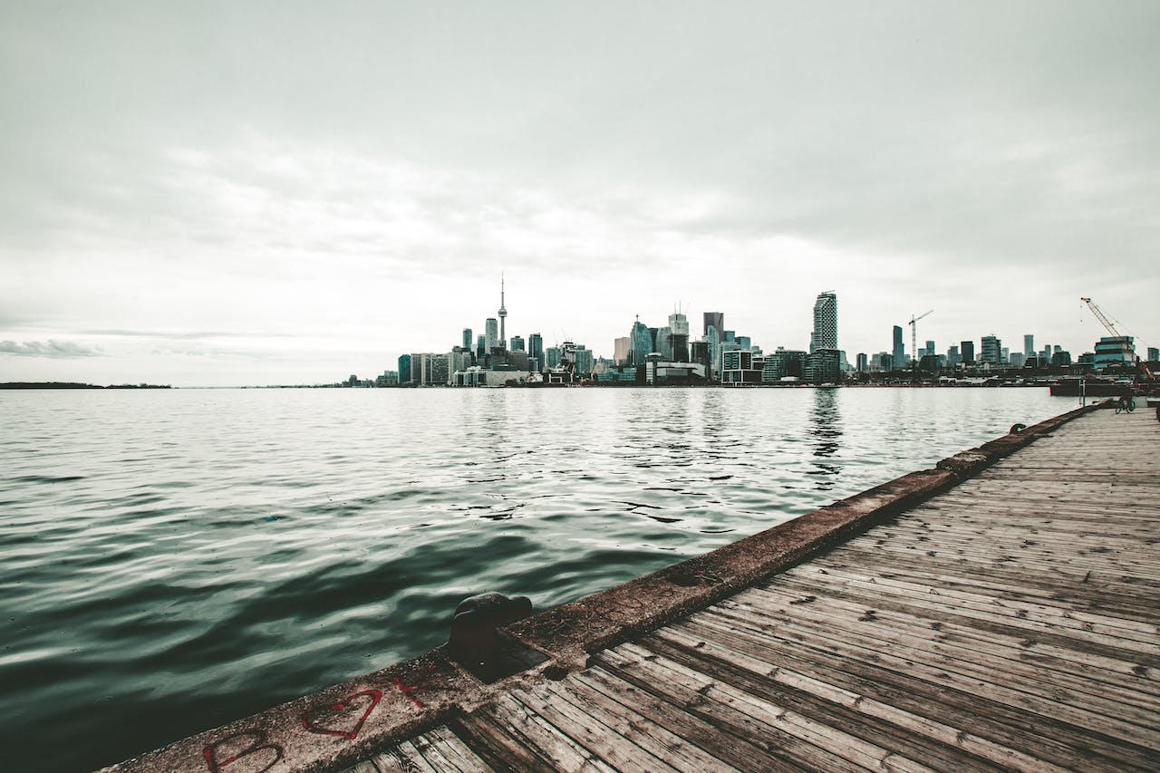Toronto skyline seen from a distant pier on Lake Ontario. 