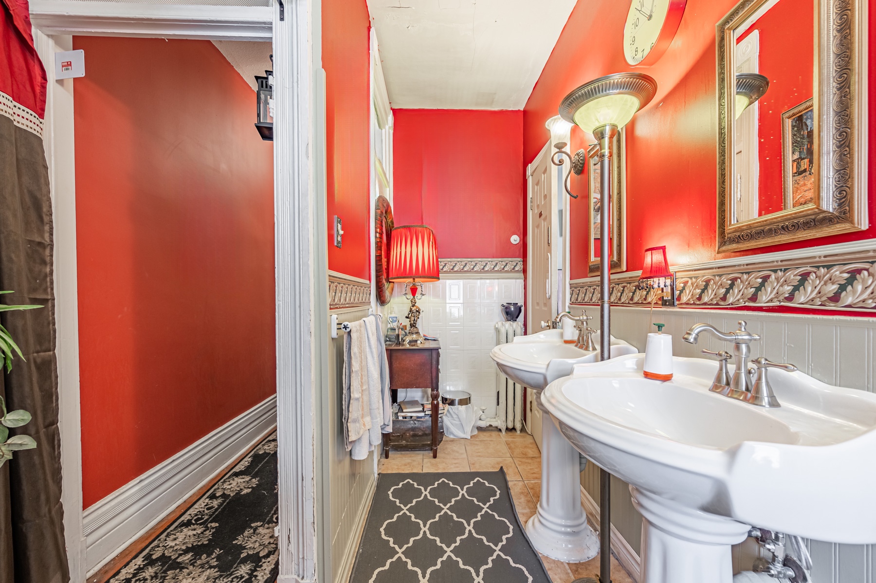 Bathroom with two sinks and vivid red walls – 74 Homewood Ave.