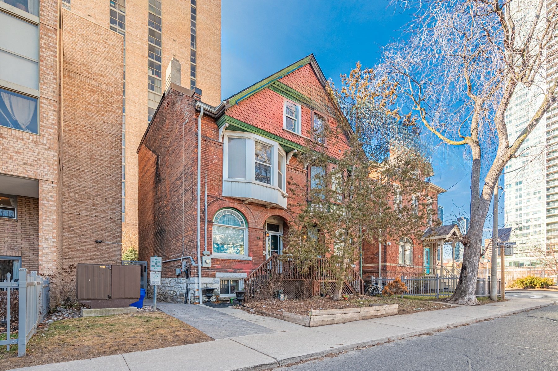 Front of 74 Homewood Ave, a 2-storey red-brick duplex.