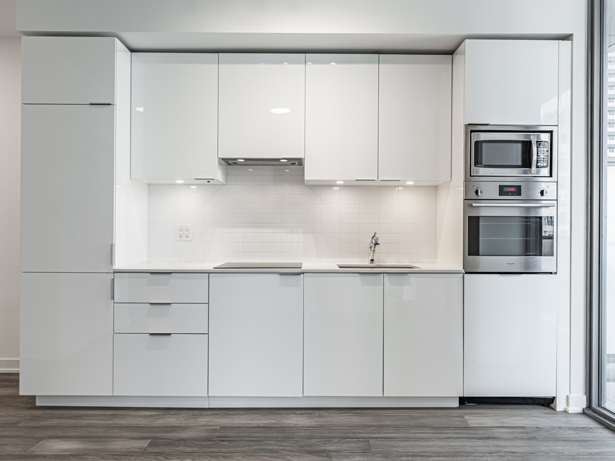 Sleek linear kitchen – 11 Wellesley St W Unit 507.