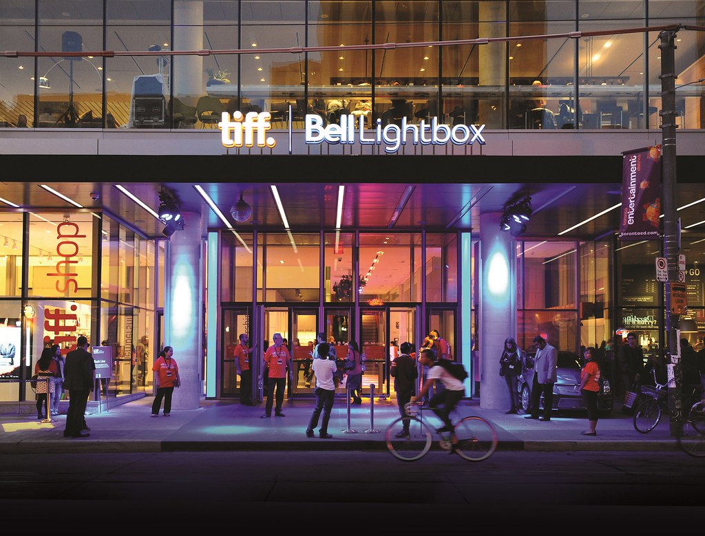 Neon-lit exterior of the TIFF Bell Lightbox building in Toronto. 