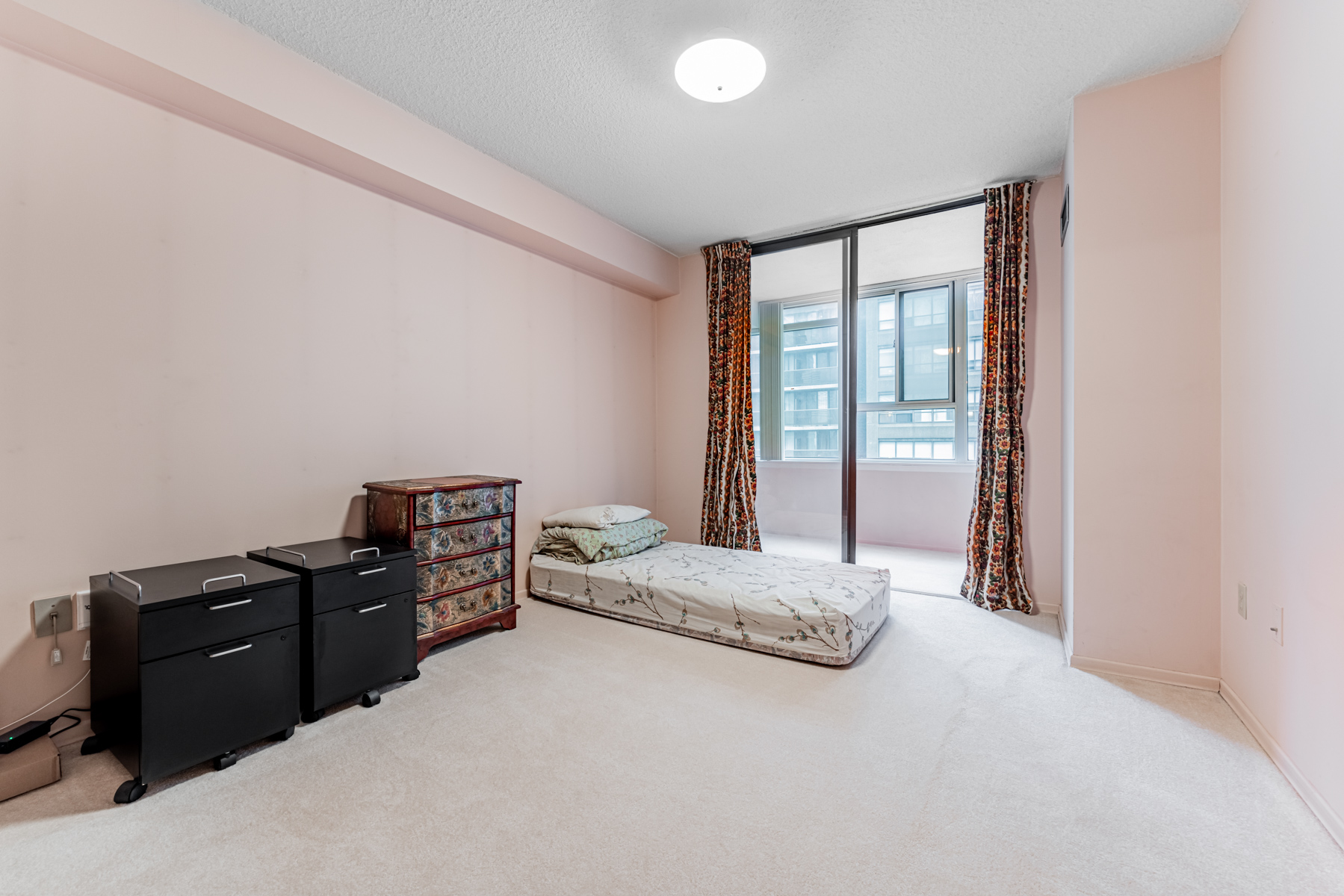 Large condo bedroom with mattress on floor – 45 Carlton St Unit 1405.
