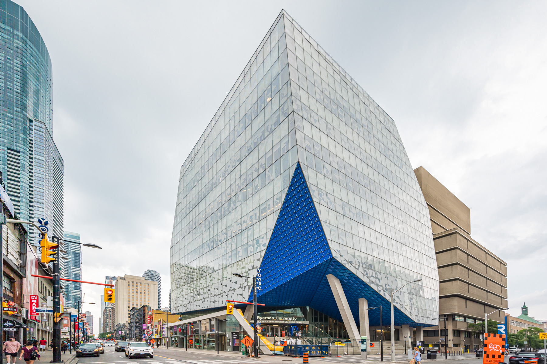 Blue, glassy exterior of Toronto Metropolitan University's Student Learning Centre.