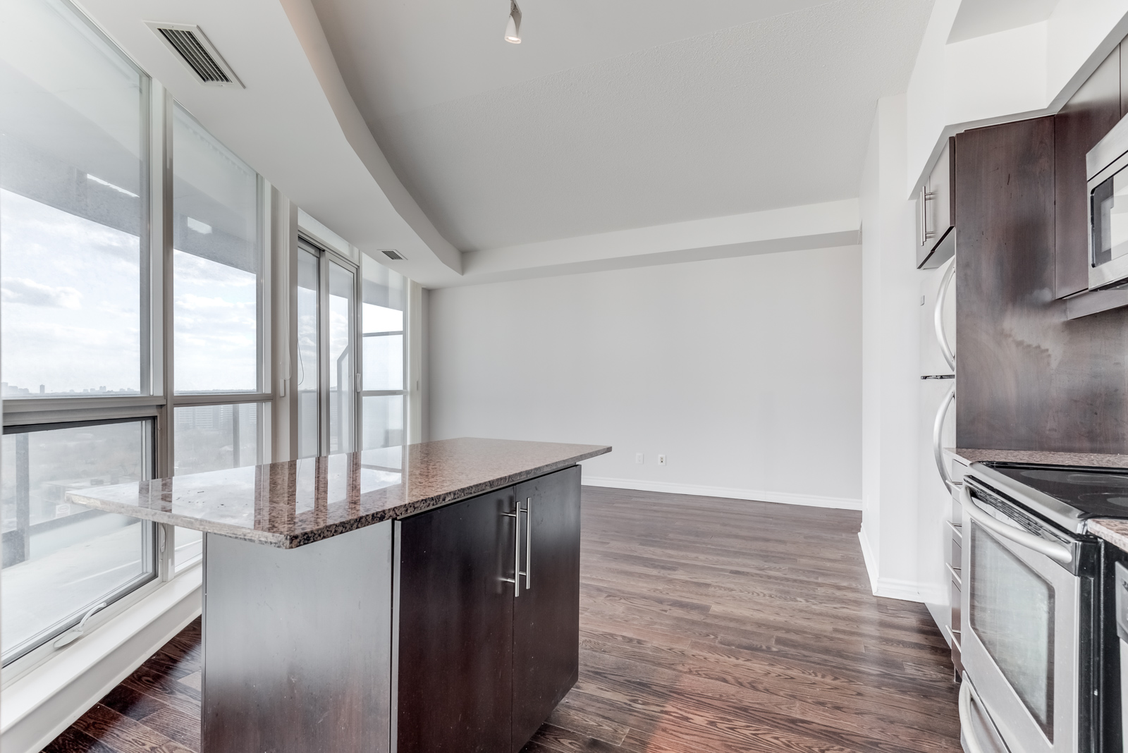 Condo breakfast bar overlooking balcony.