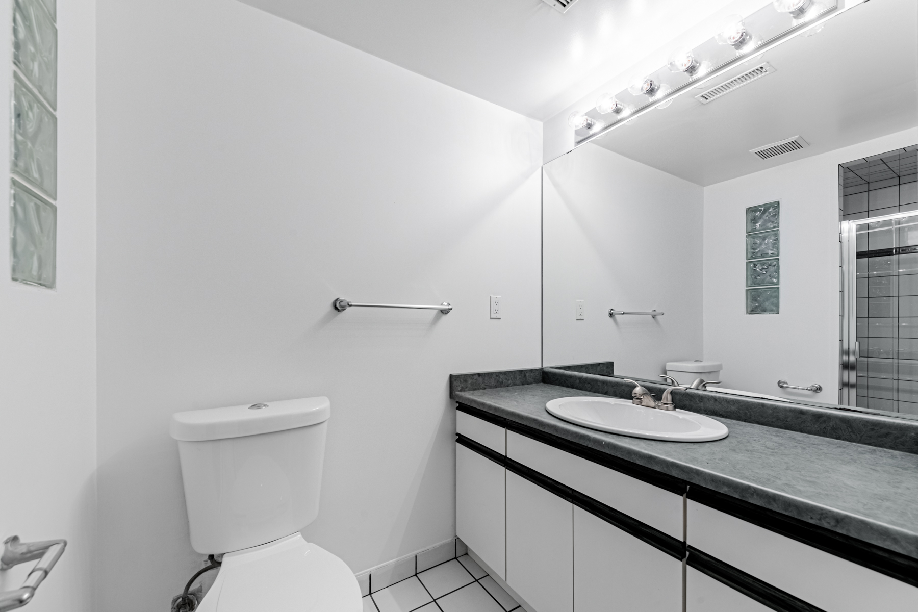 36 Earlton Rd 3-piece bathroom with built-in vanity and ceramic floors.
