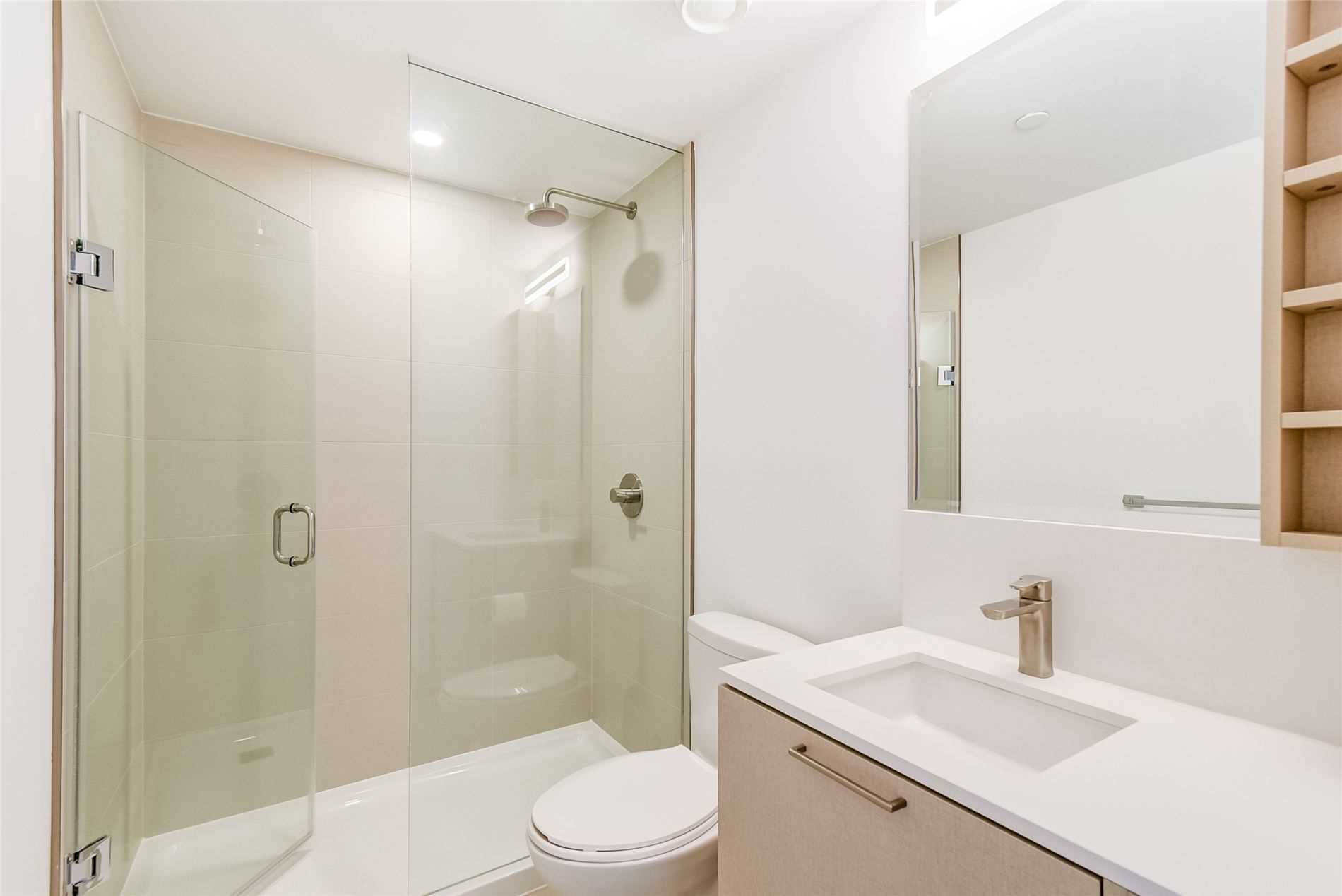 19 Western Battery Rd Unit 2921 3-piece bath with glass-door shower.