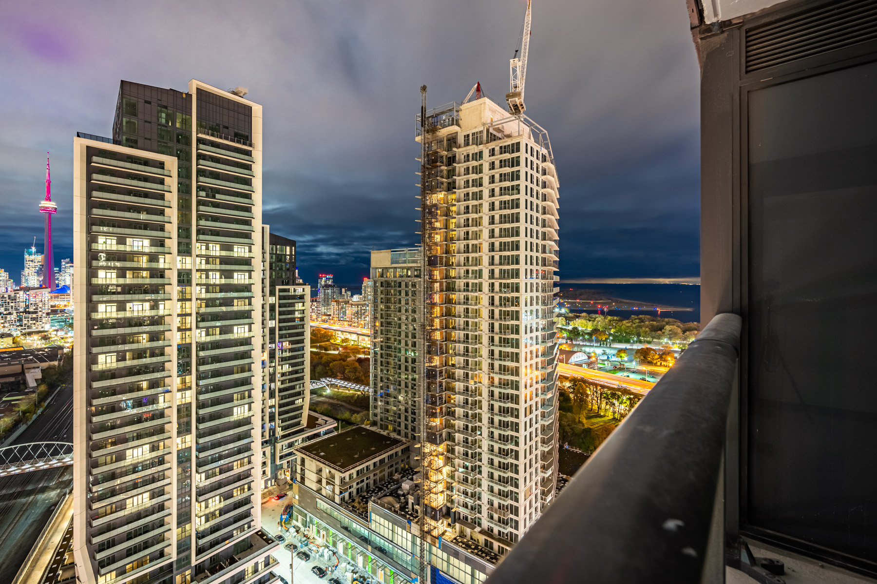 View of Lake Ontario at night from condo balcony.