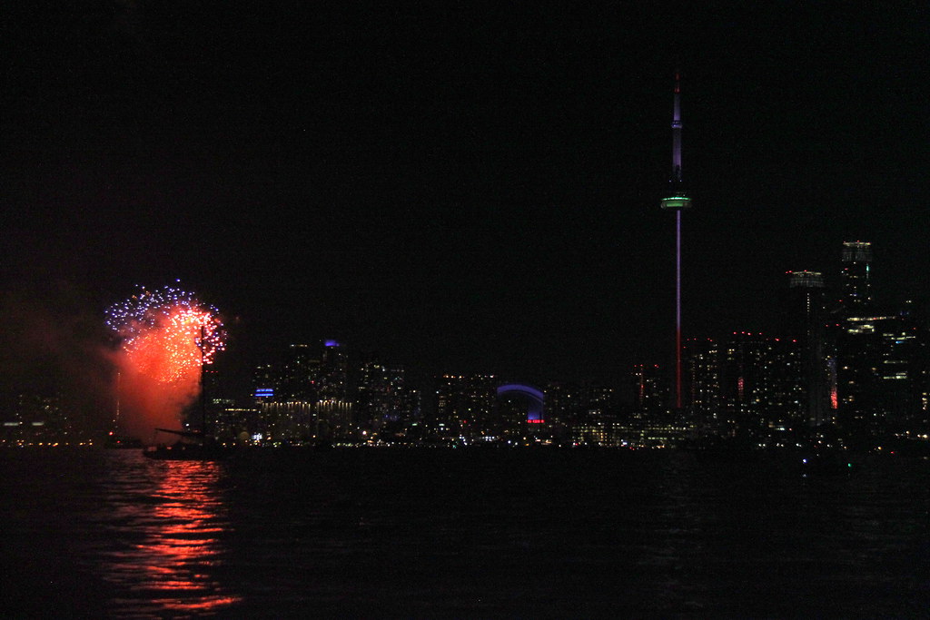 Fireworks along Toronto Waterfront as seen from Lake Ontario on New Year's night. 