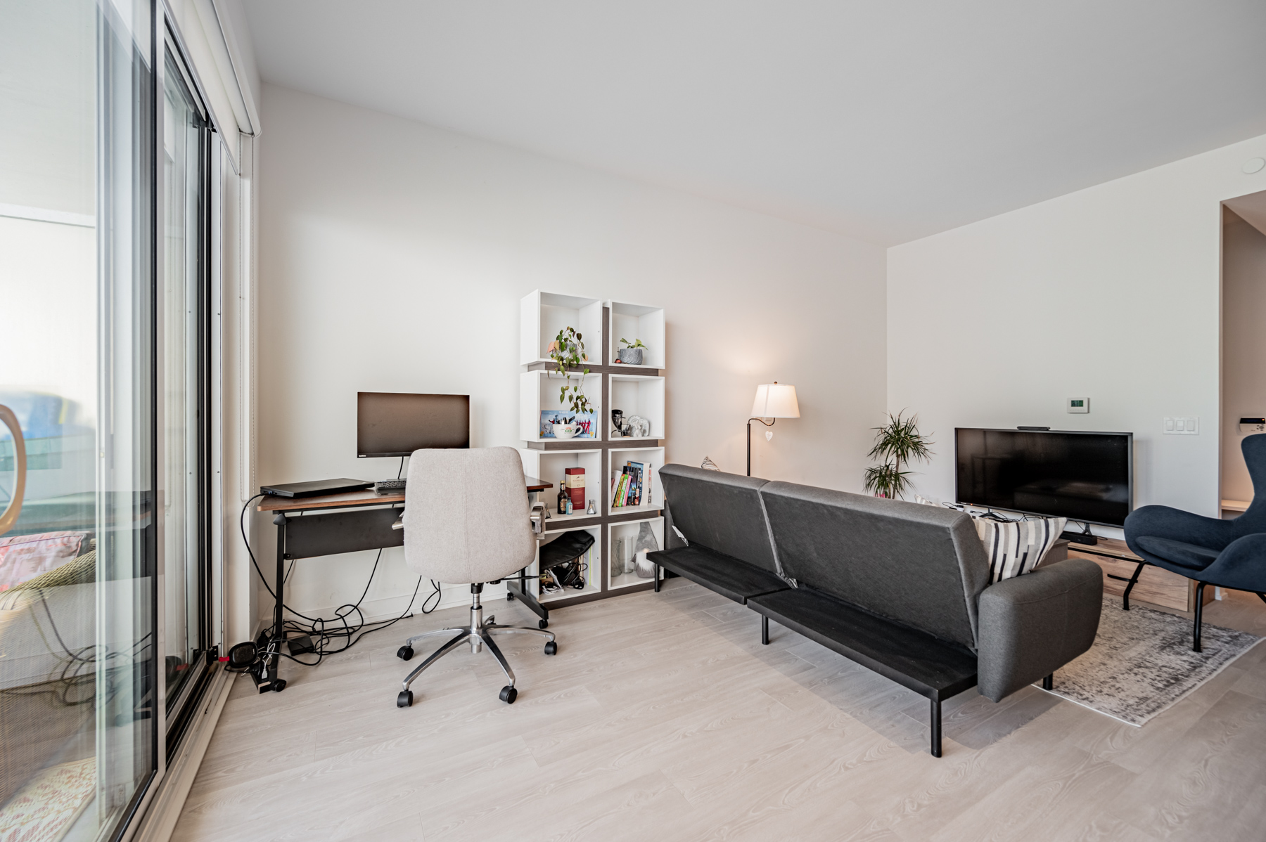 Condo living room with home-office setup.