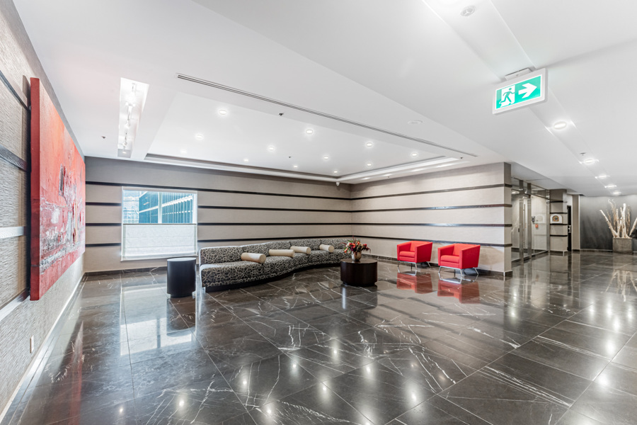 8 Park Rd condo's lobby, with modern furniture and décor.