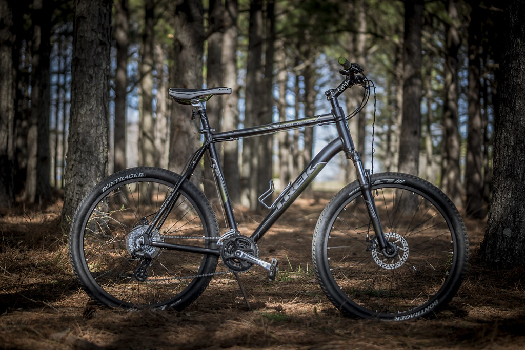 Black mountain bike in forest. 