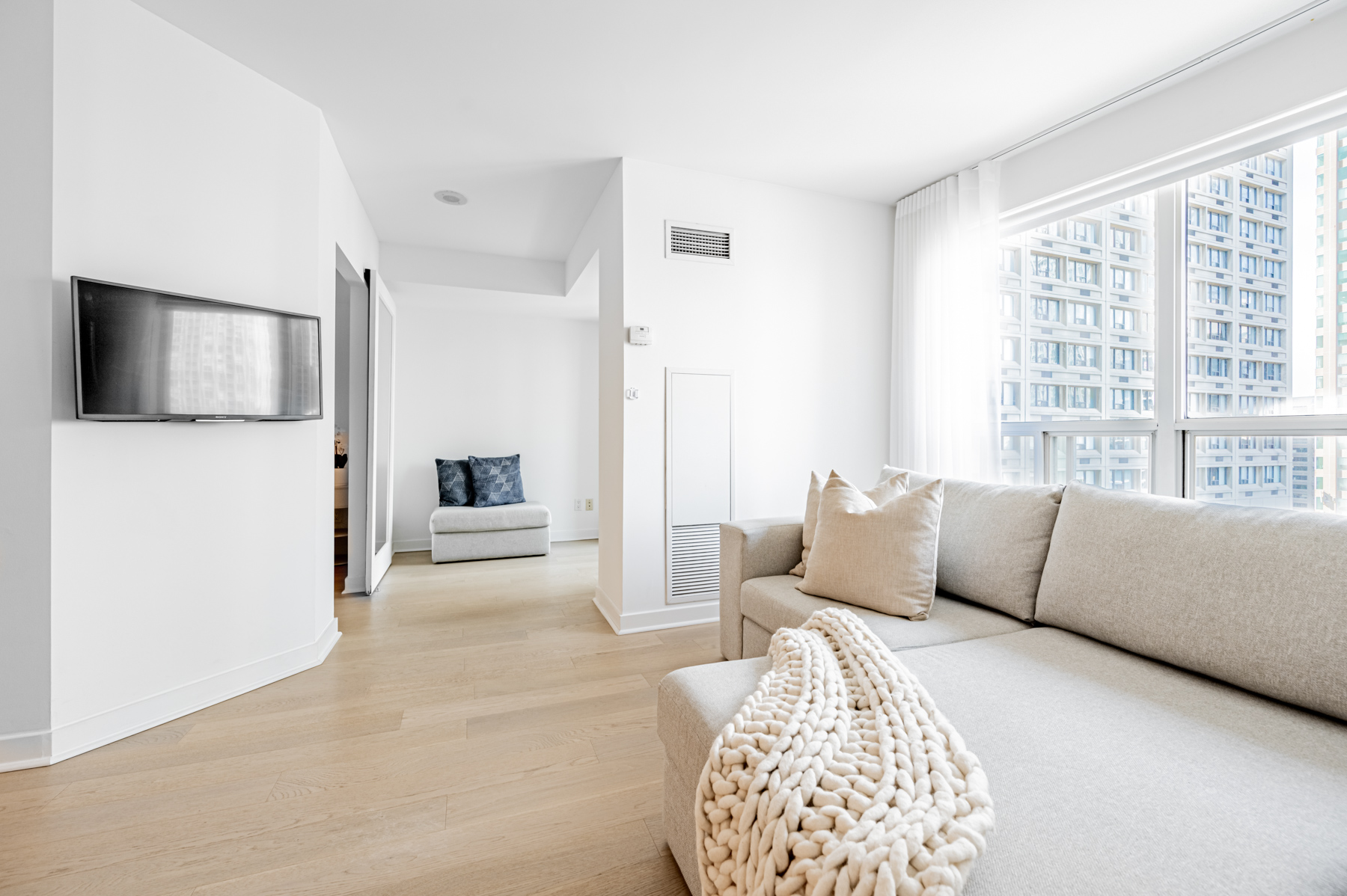 Naturally lit living room and den of 8 Park Rd Unit 2315.