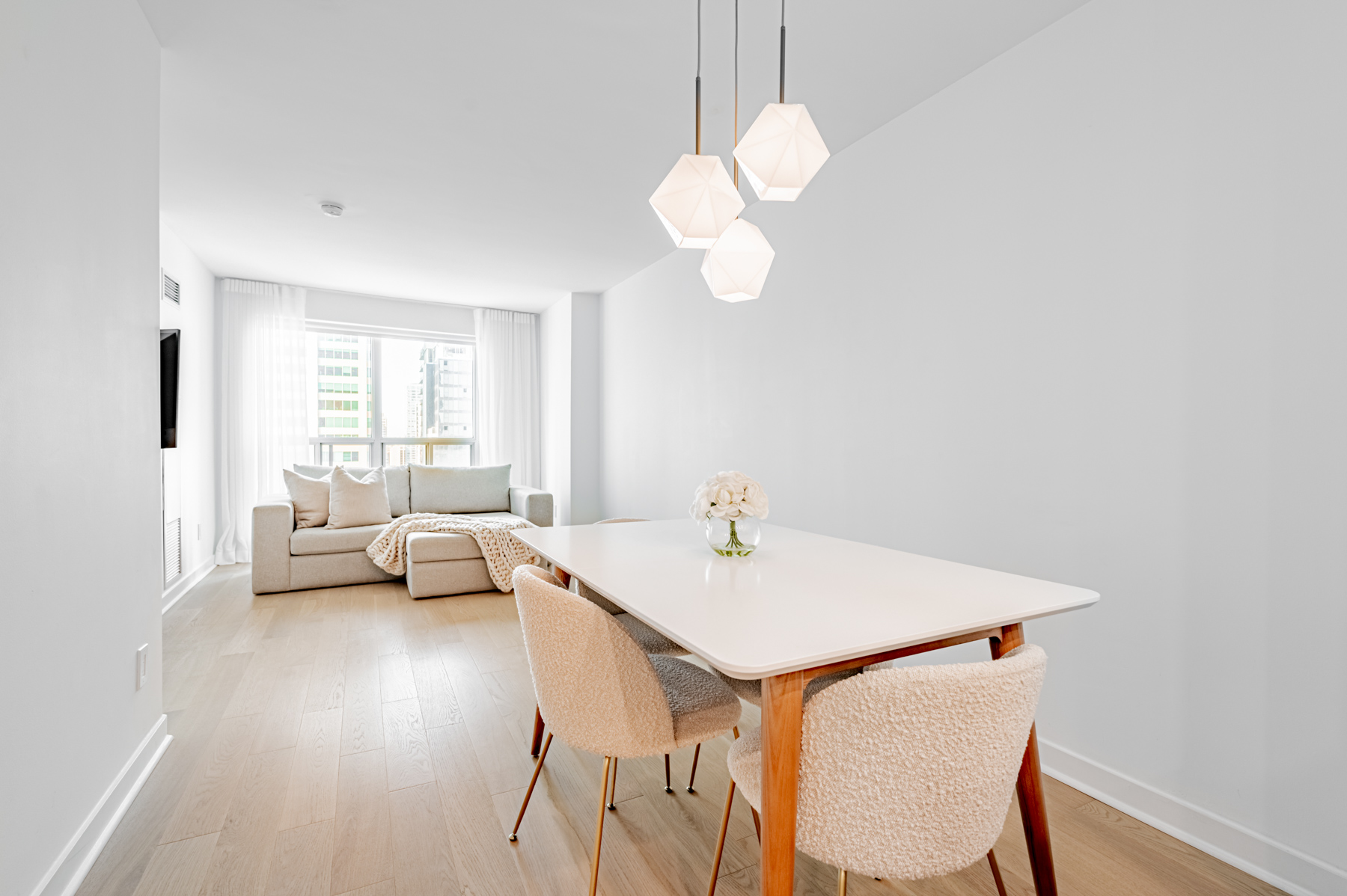 8 Park Rd Suite 2315 dining room with table and chic LED pendent lights.