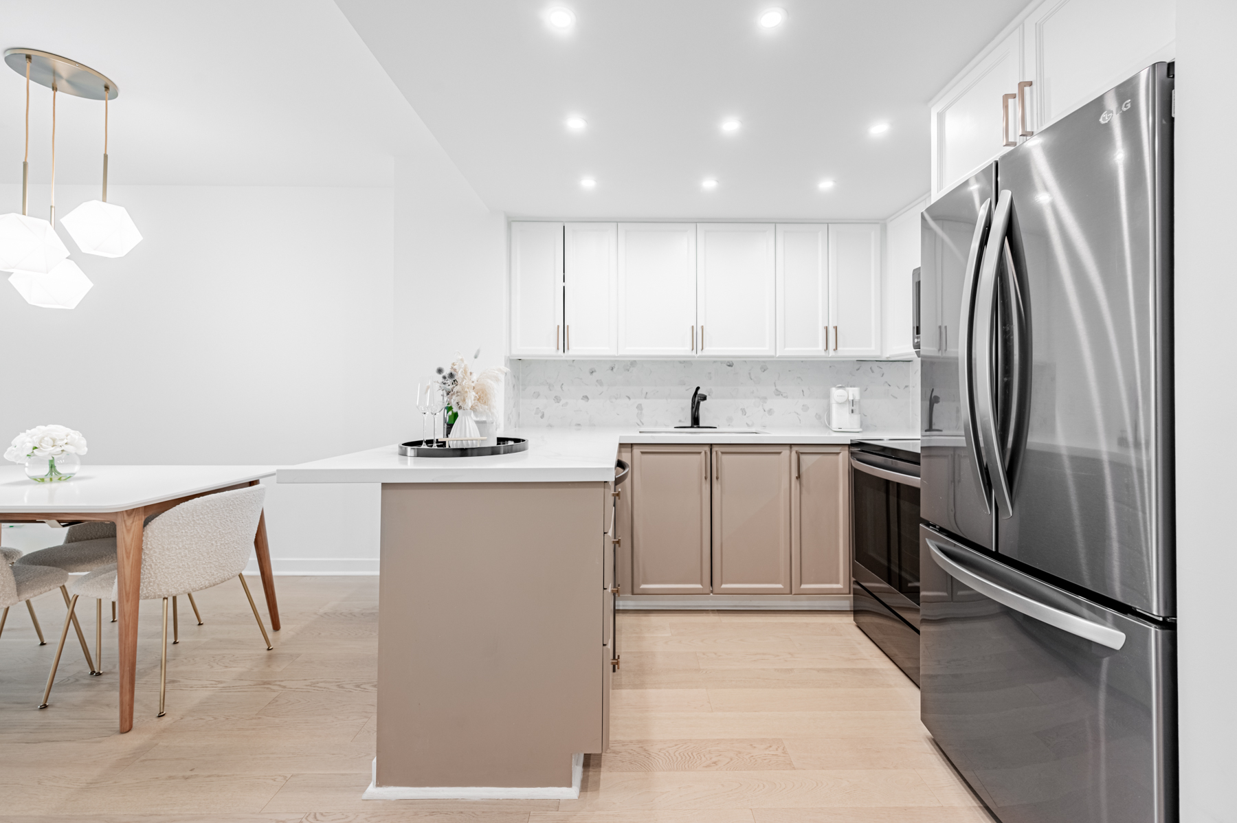 8 Park Rd Unit 2315 u-shaped kitchen with several cabinets and cupboards.