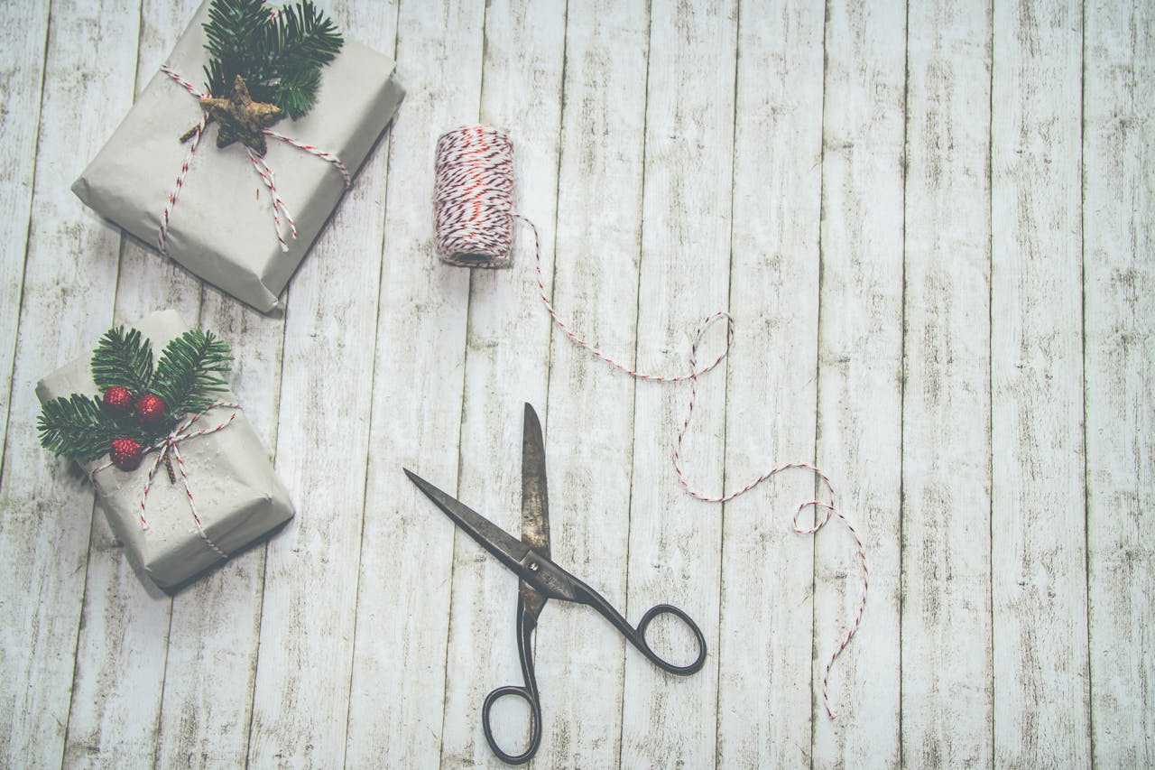 Christmas gifts, twine, scissors to show October rate cut and other cuts.