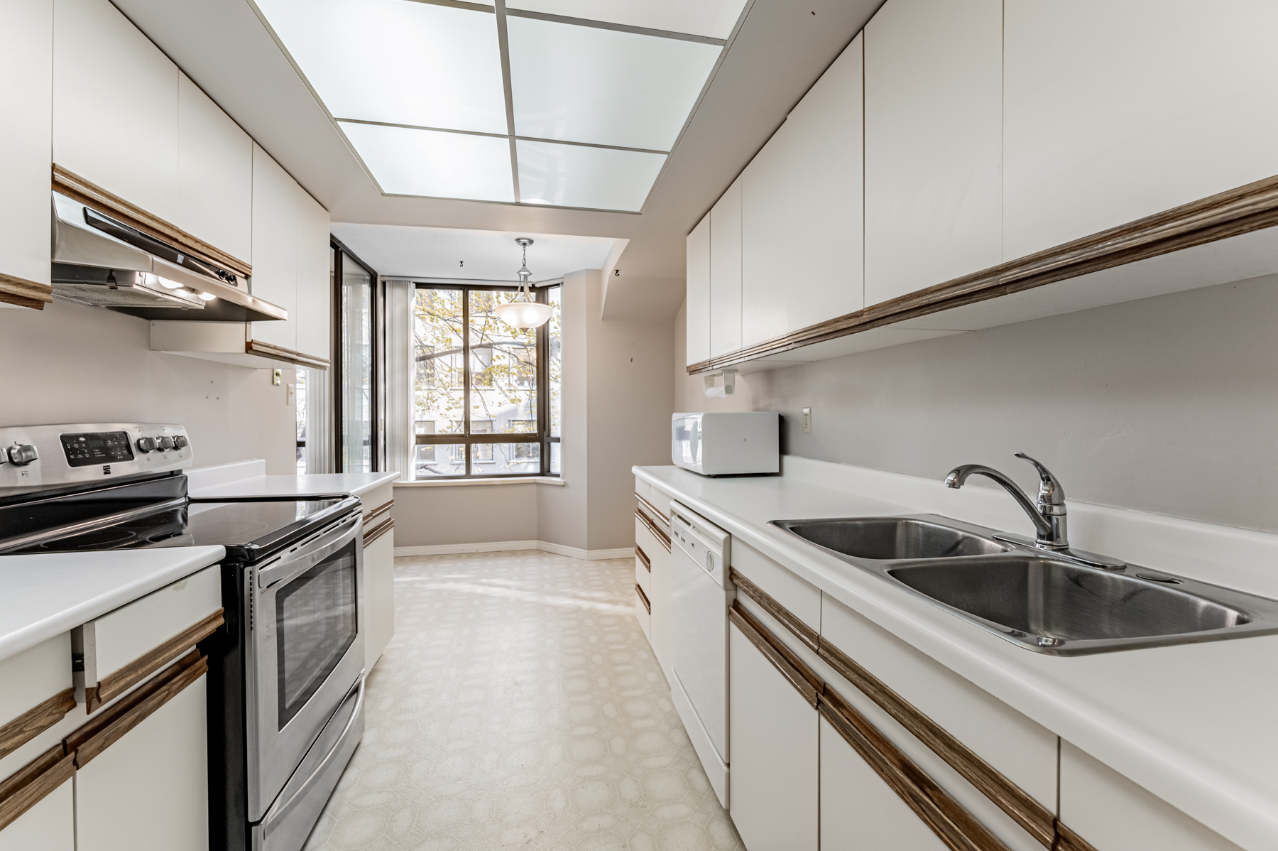 Long galley kitchen of 280 Simcoe St 308A.