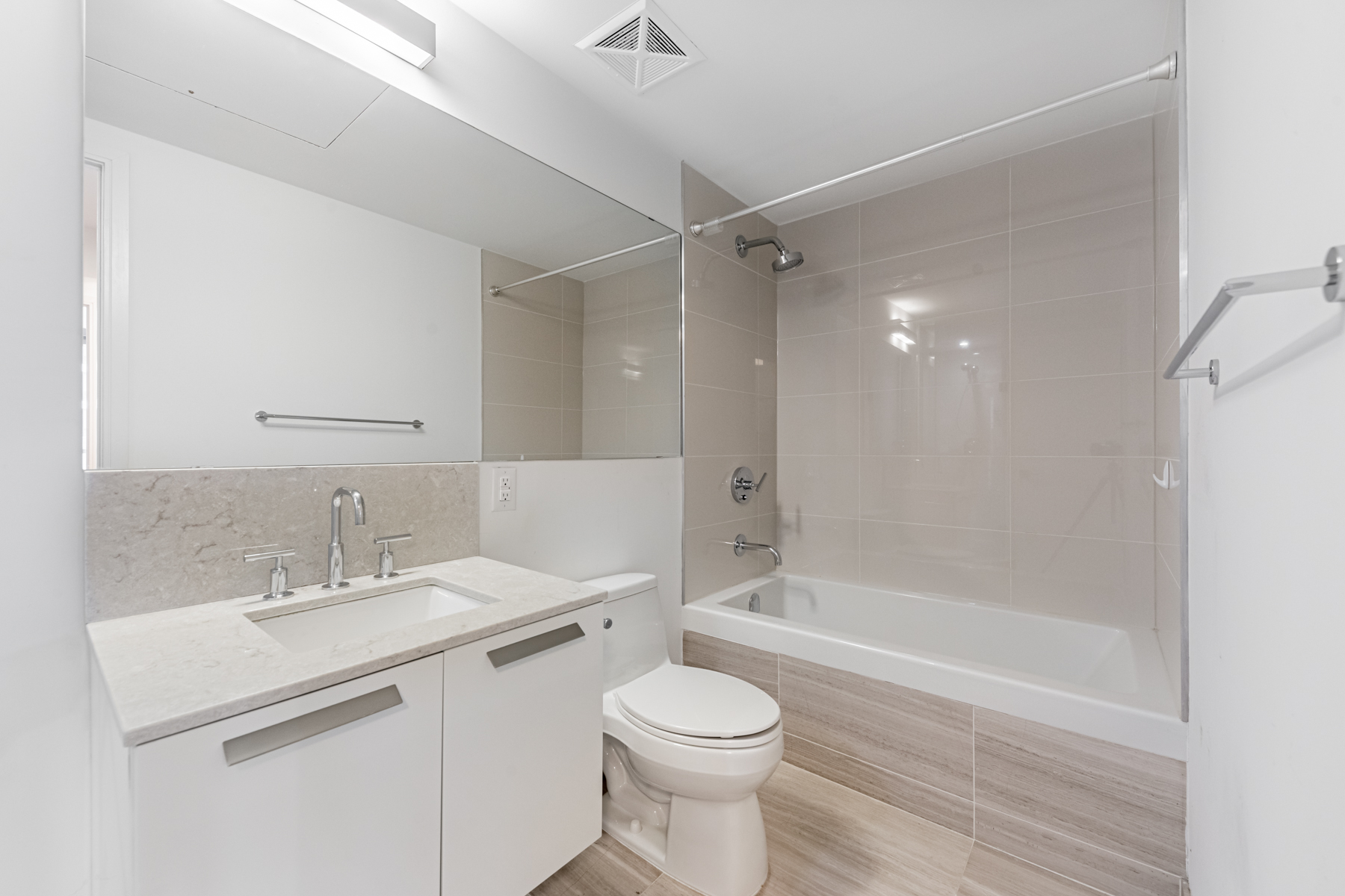 Luxurious 4-piece bath with sleek tiles and soaker tub -- 57 St Joseph Street Unit 523.