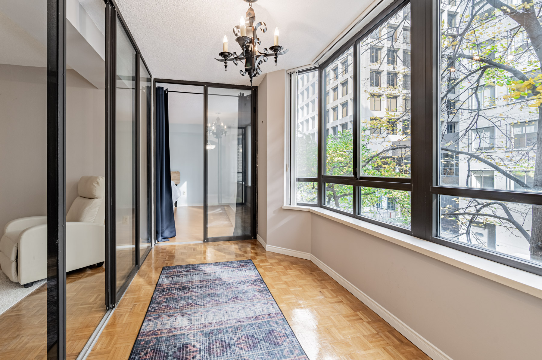 Brightly lit condo sunroom – 280 Simcoe St 308A.