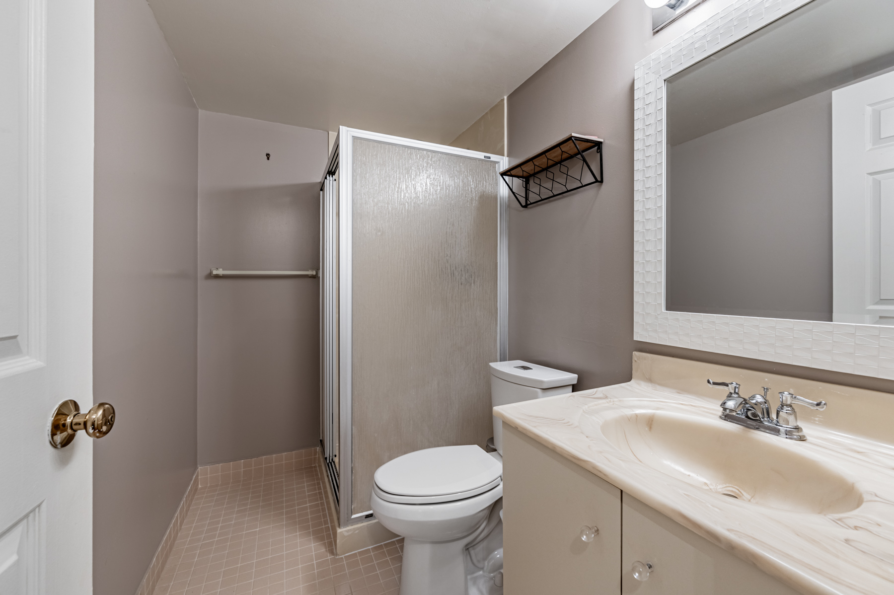 3-piece condo bath with dark gray walls - 280 Simcoe St 308A. 