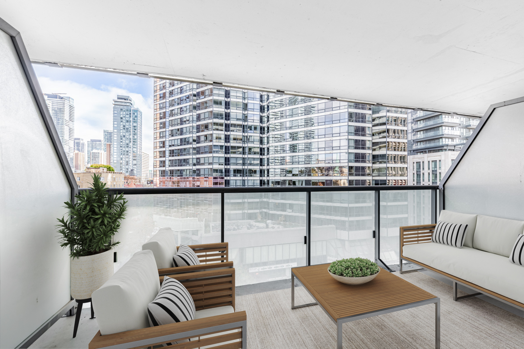 57 St Joseph Street Unit 523 -- 2nd floor balcony with 3D-rendered patio furniture.