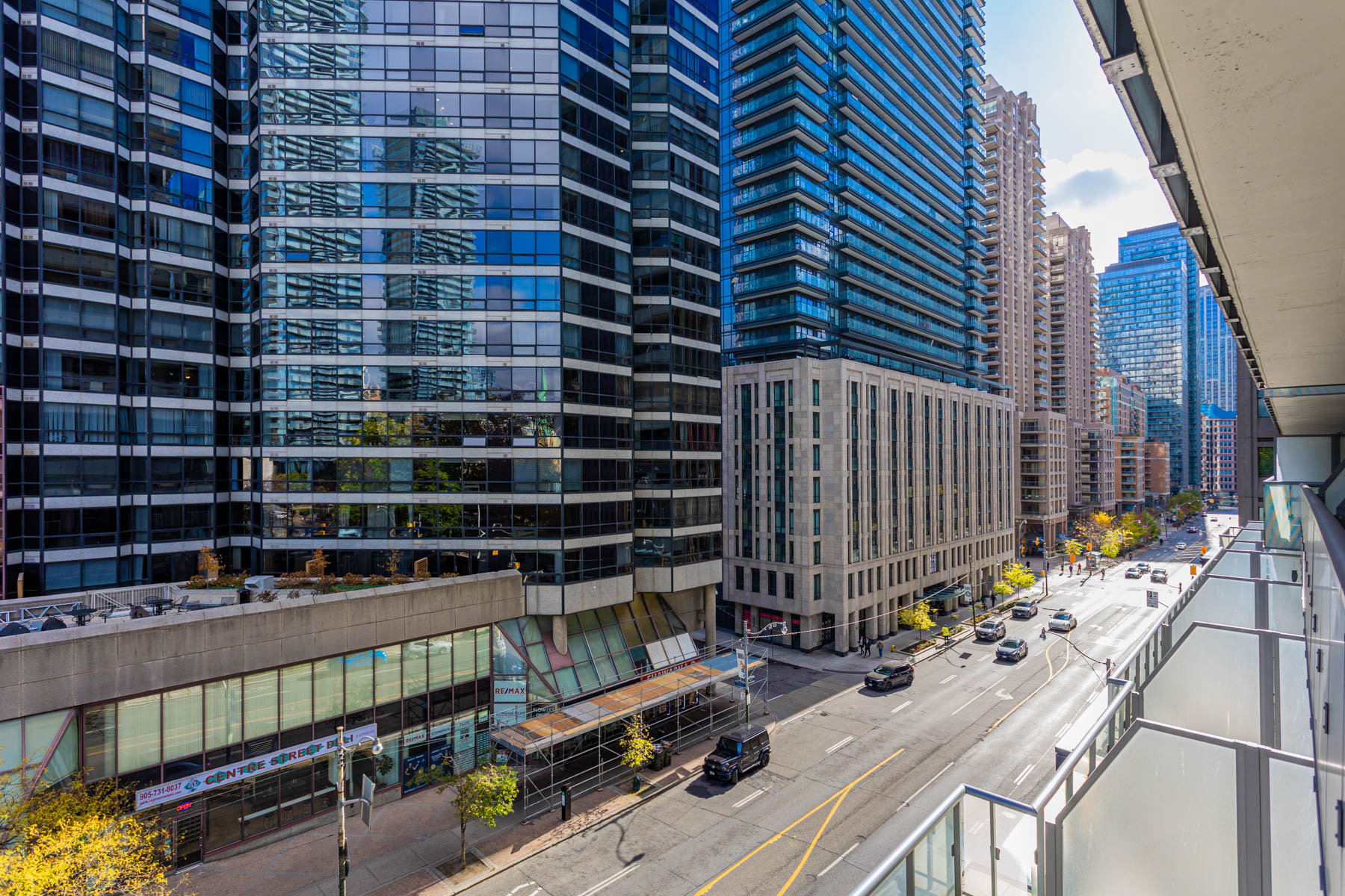 View of Bay Street Corridor buildings and streets from balcony of 57 St Joseph Street Unit 523.