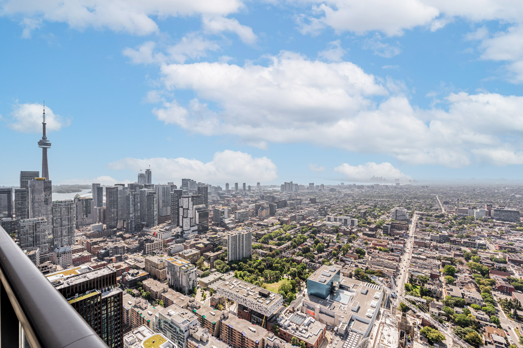 View of Toronto, including OCAD University, CN Tower and Lake Ontario, from balcony of 488 University Ave Unit 5408.