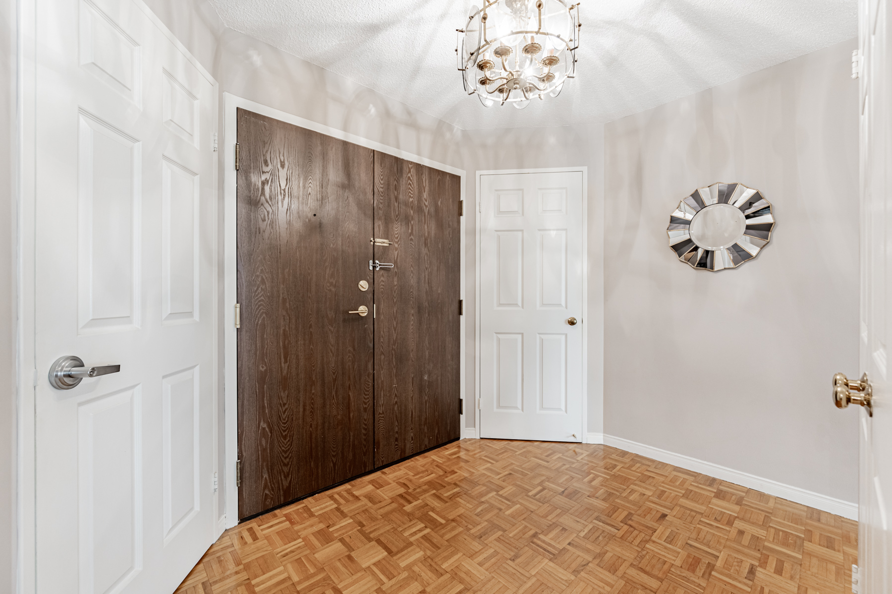 280 Simcoe St Unit 308A front entrance with dark wood double doors.