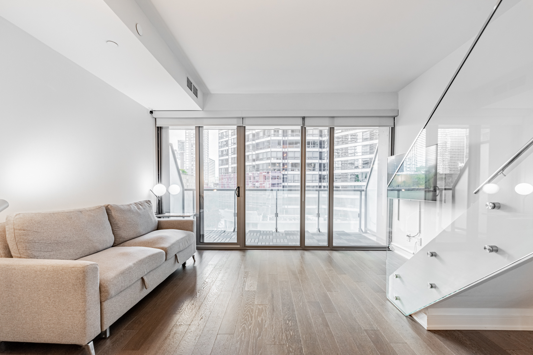 Condo balcony with view of downtown Toronto.